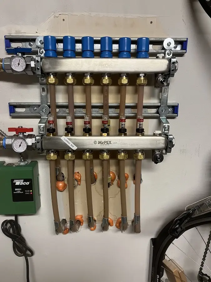 Plumber performing Gas Leak Detection at a residential property in West Warwick